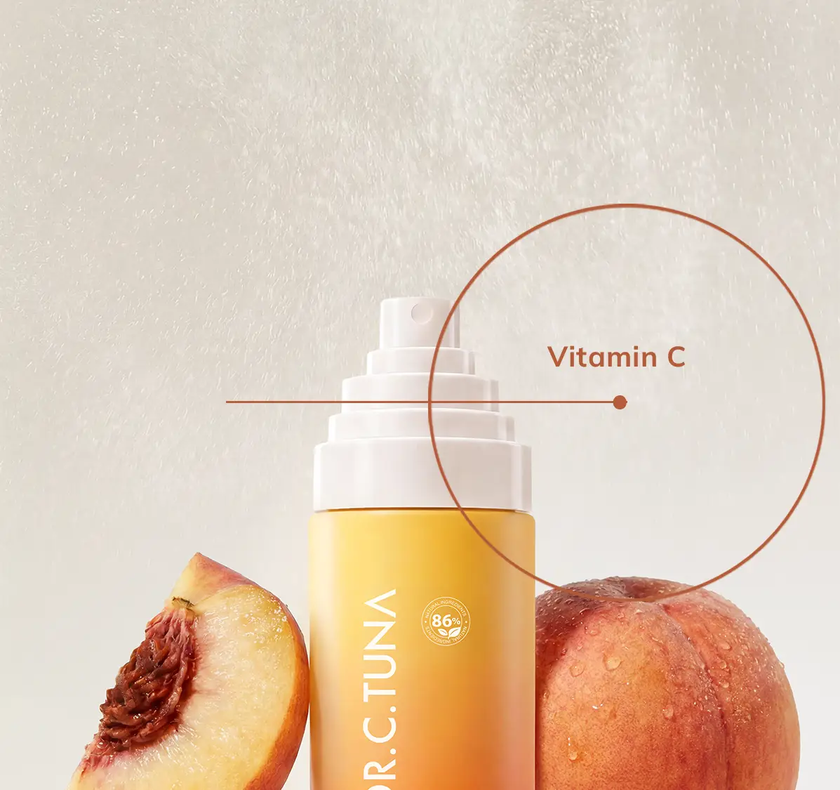 Face mist bottle with peach and vitamin C graphic